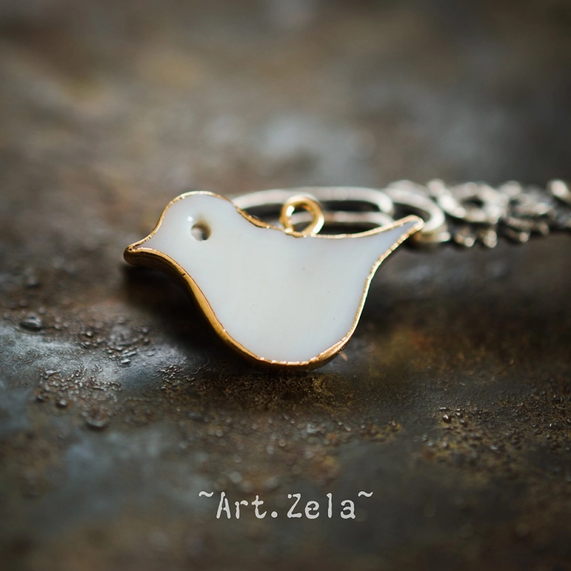Pendentif oiseau nacre naturelle 25x16.5 mm X1 Pendentif laiton et nacre