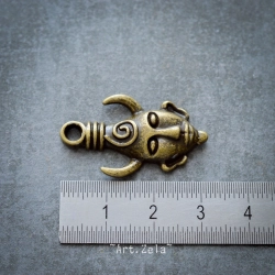 Petits pendentifs masques primitifs 32mm X2 Breloque métal ton bronze