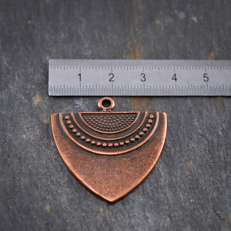 Pendentif cuivré style ethnique 35mm X1 Métal orné de petits motifs