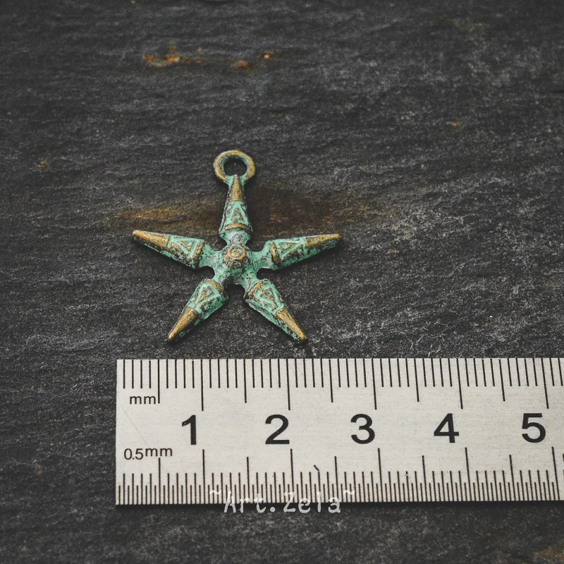 Breloque étoile de mer stylisée 2,8mm X4 Métal bronze patiné