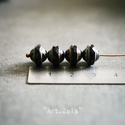 Saturne Picasso noir10x8mm X12 Perles verre tchèque opaque