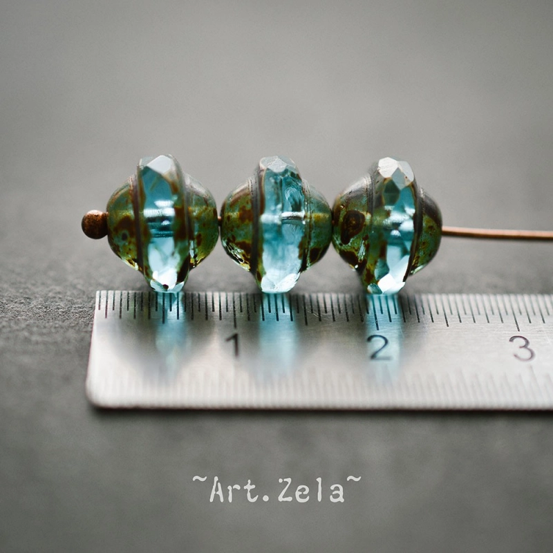 Saturne Picasso turquoise X8 Perles verre tchèque transparent