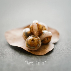 Saturne Picasso beige rosé 10x8mm X10 Perles verre tchèque
