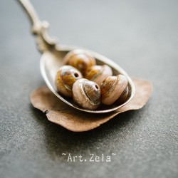 Saturne Picasso beige rosé 10x8mm X10 Perles verre tchèque
