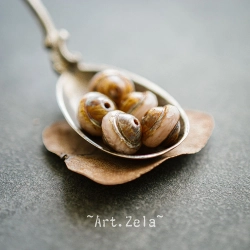 Saturne Picasso beige rosé 10x8mm X10 Perles verre tchèque