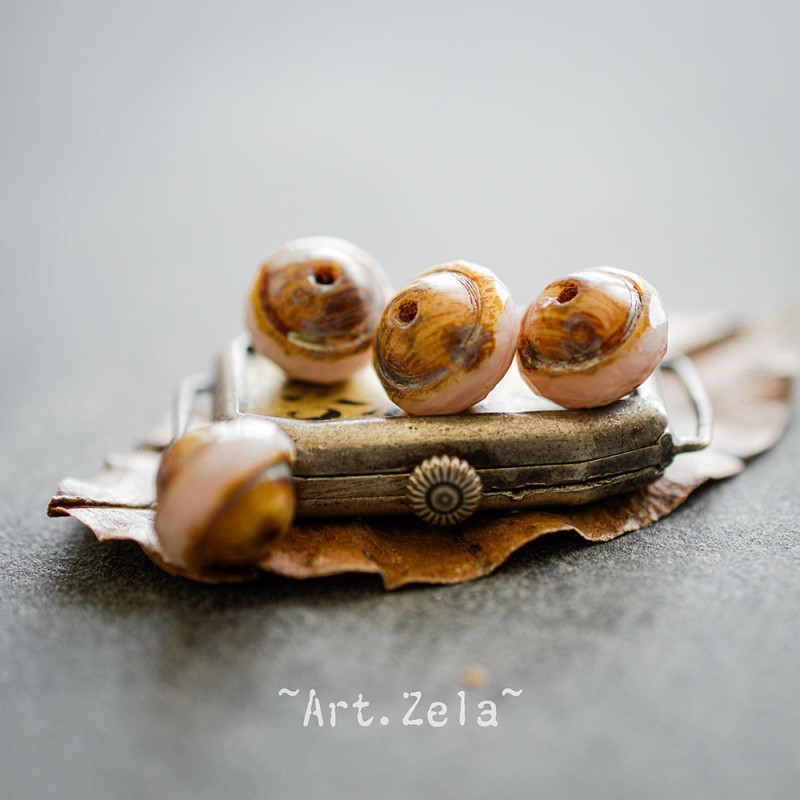 Saturne Picasso beige rosé 10x8mm X10 Perles verre tchèque